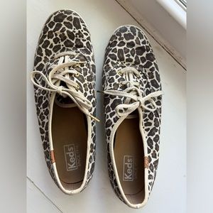 Keds women’s classic champion in animal tan, multi print canvas lace sneakers.